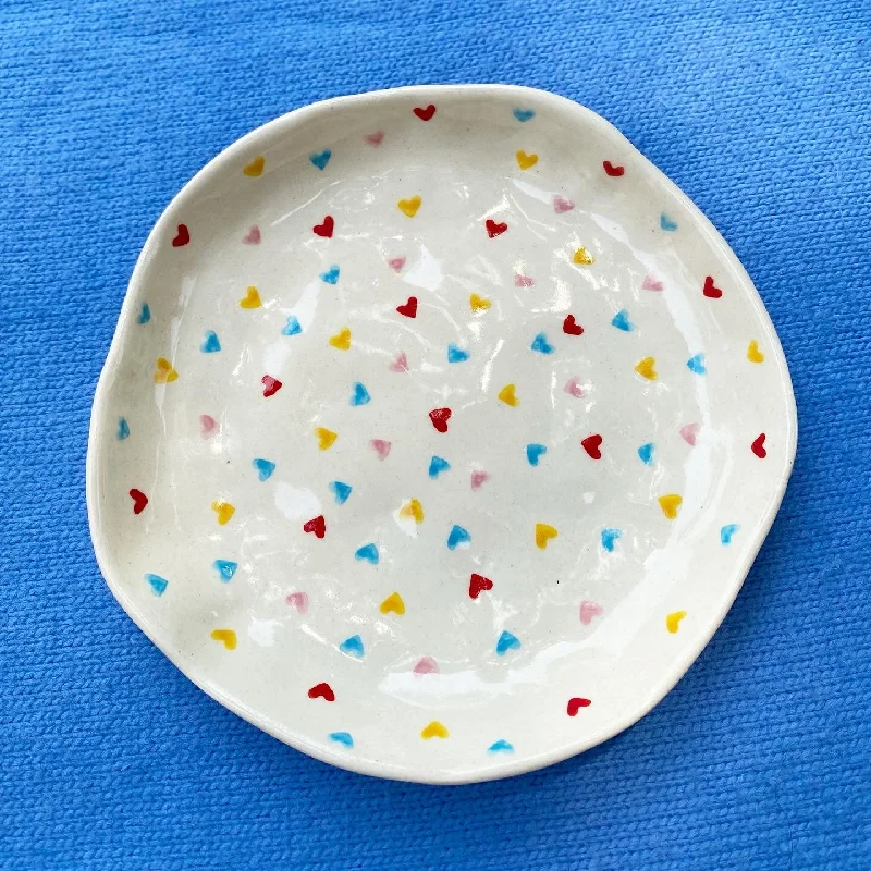 fun dinnerware for kids-Multi colour hearts wobbly snacking plate. Size is 6”.